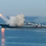 Missiles Intercepted, War Expands Warship launching a missile at sea