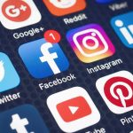15 Under Kids’ Feeds Banned— Adults Next? Smartphone screen showing social media app icons