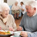 Midlife Metabolism Plot Twist Elderly couple enjoying a meal together in a dining room