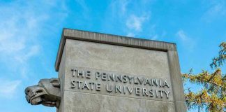 The Pennsylvania State University stone pillar with lion sculpture.