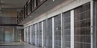 Putin Move Frees U.S. Marine — But Why Now? prison cell block with metal barred doors