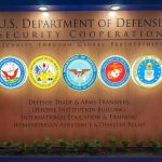 Navy Power Play: CIO Locked, Billions At Stake U.S. Department of Defense display wall with service seals