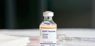 MMR vaccine vial on a white surface