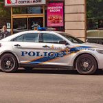 Louisville police car parked on city street