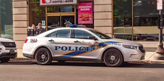 Louisville police car parked on city street