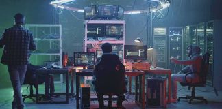Nationwide Revolt Hits AI Megasites People working at computers in a dim server room
