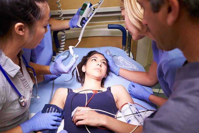shutterstock_168768599 Patient on hospital gurney surrounded by medical staff