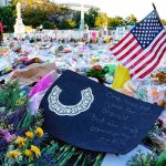 Crowdfunding a Murder Trial — Lines Blurred Memorial site with flowers and a U.S. flag