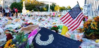 Crowdfunding a Murder Trial — Lines Blurred Memorial site with flowers and a U.S. flag