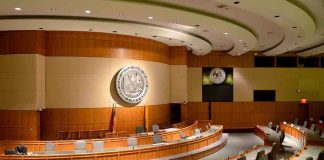 Contempt Vote For Fauci Fifth Amendment Firestorm Interior view of a government chamber with wooden paneling and seating