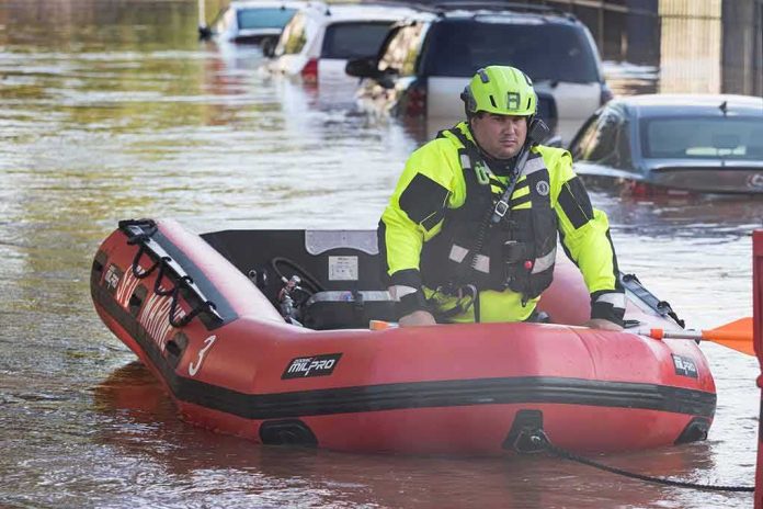 Rescue worker in an inflatable boat during urban flooding