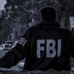 Cartel Horror: FBI Mole’s Bone-Chilling Claim FBI agent in jacket facing a city street at dusk