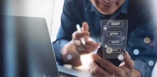 Billion-User Claim Sparks Data Fight Person using smartphone with chat bubbles and laptop