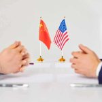 War With China? Rubio’s Stark Warning Two diplomats sit across table with China and United States flags between them