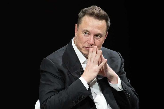 shutterstock_2318800287 man in a suit with hands clasped thoughtfully