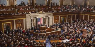 Taxpayer Heist Exposed — Billions Blocked Legislative chamber filled with attendees during a formal address