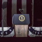 High-Stakes Optics: Trump Teases Kim Meeting Presidential podium with microphones and teleprompters