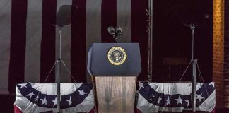 Presidential podium with microphones and teleprompters
