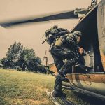 Mass Rescue Stuns Nigeria Soldier boarding a helicopter during field operation