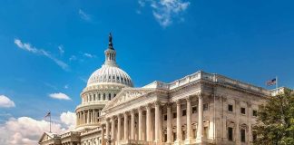 Sanctions Net Tightens—Banks on Edge United States Capitol building with dome and columns under a blue sky
