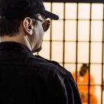 Twenty Years – But Who Failed Those Marines? Security guard watching inmates behind jail bars