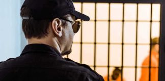 Twenty Years – But Who Failed Those Marines? Security guard watching inmates behind jail bars