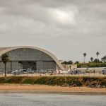 Warplane Plea Denied — Twice airport hangar with helicopters near a shoreline