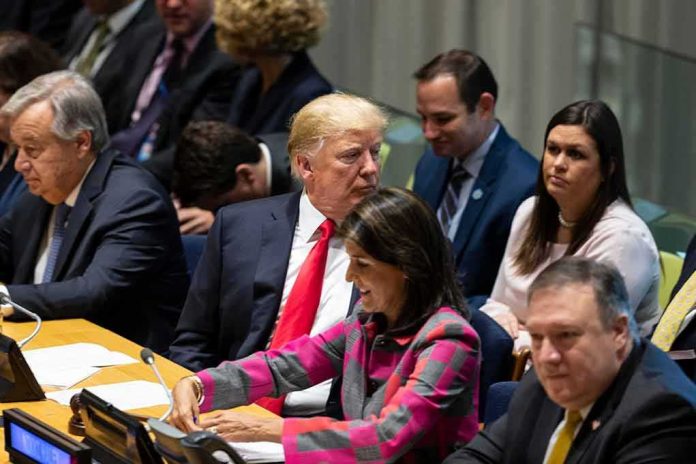 shutterstock_1187477929 Donald Trump seated between António Guterres and Nikki Haley, with Mike Pompeo in the foreground at a meeting