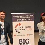 Heckler Targets Kirk’s Widow — Chaos Erupts Curro Savoy at a TPUSA event with another speaker on stage