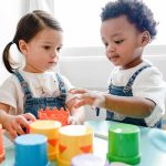 2-Year-Old’s Life is Ended, THEN Prosecutor Looped In Toddlers playing with colorful stacking cups at a table