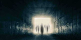 White House Pushes UFO Dump – What’s Inside? Silhouetted figures at the end of a dark tunnel