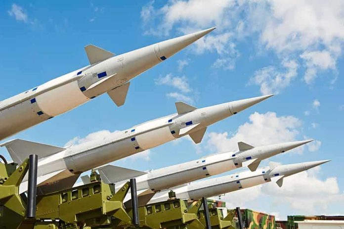 Surface-to-air missiles on launchers angled toward the sky