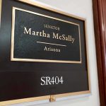 Office door plaque with senator name and room number