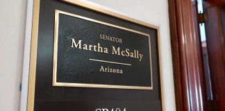 Office door plaque with senator name and room number