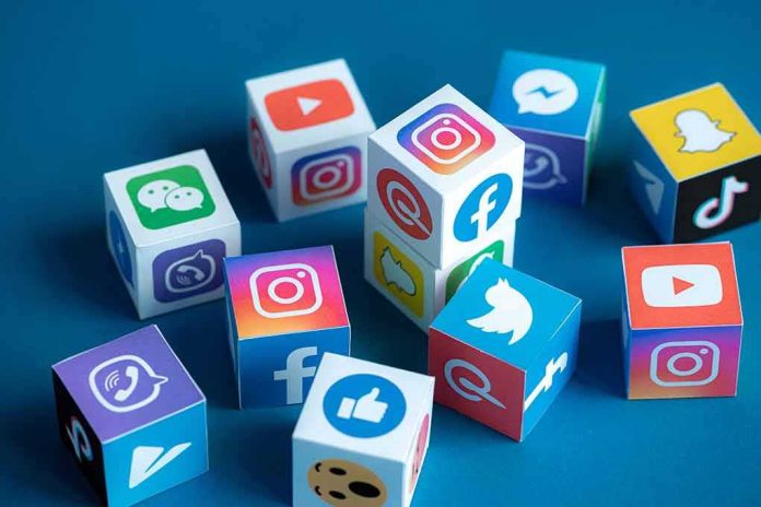 Social media icons on colorful cubes scattered on a blue surface