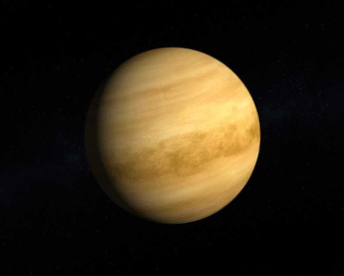 Planet with yellowish cloud bands in space