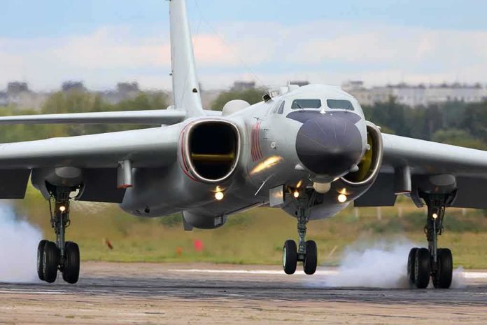 Military jet bomber landing on runway