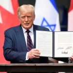 Trump’s July 4 Shock Upends Renewables Donald Trump holding a signed document at a ceremony