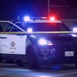 Hanging Death Reversal Sparks Arrest Police SUV with flashing lights at night behind yellow tape