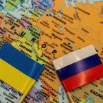 War Jumps The Fence—St. Petersburg Hit Ukraine and Russia flags on a map of Eastern Europe