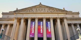 Neoclassical museum facade with tall columns and wide stone steps