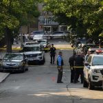 Hollywood Heir, No Death Bid Police officers secure a residential street with patrol cars and yellow tape