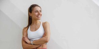 WNBA Star Torches Sydney Sweeney Spot Woman in athletic wear smiling with arms crossed