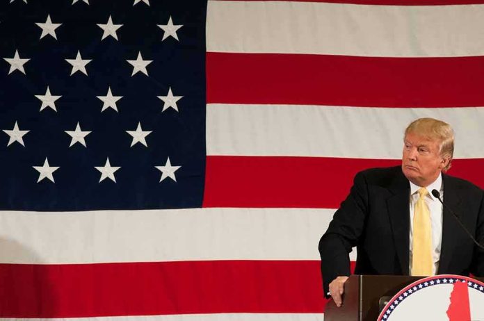 Donald Trump at a podium with a large American flag backdrop