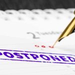 Taxpayer Bill Explodes: Paid To Not Work Fountain pen over calendar with postponed stamp