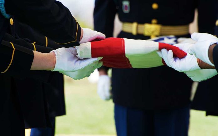 shutterstock_49188481 Military personnel folding a flag during a ceremonial event