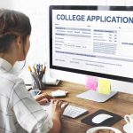 Trump Warns Republicans… Student completing a college application on a desktop computer