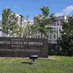 Travel Gridlock Looms After U.S. Alerts U.S. embassy sign in landscaped grounds