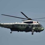 Trump Breaks Protocol On The Tarmac Green and white helicopter in flight