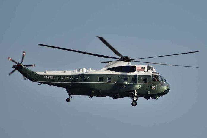 Green and white helicopter in flight